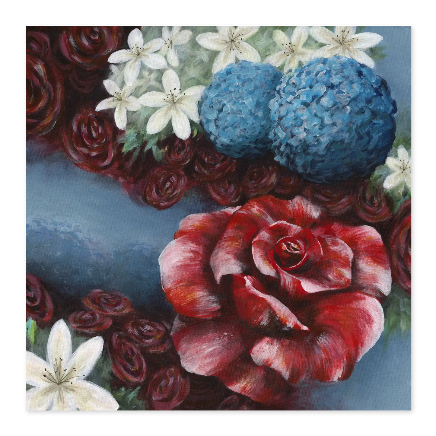 Colorful floral arrangement with red roses, blue hydrangeas, and white lilies on a blue background.