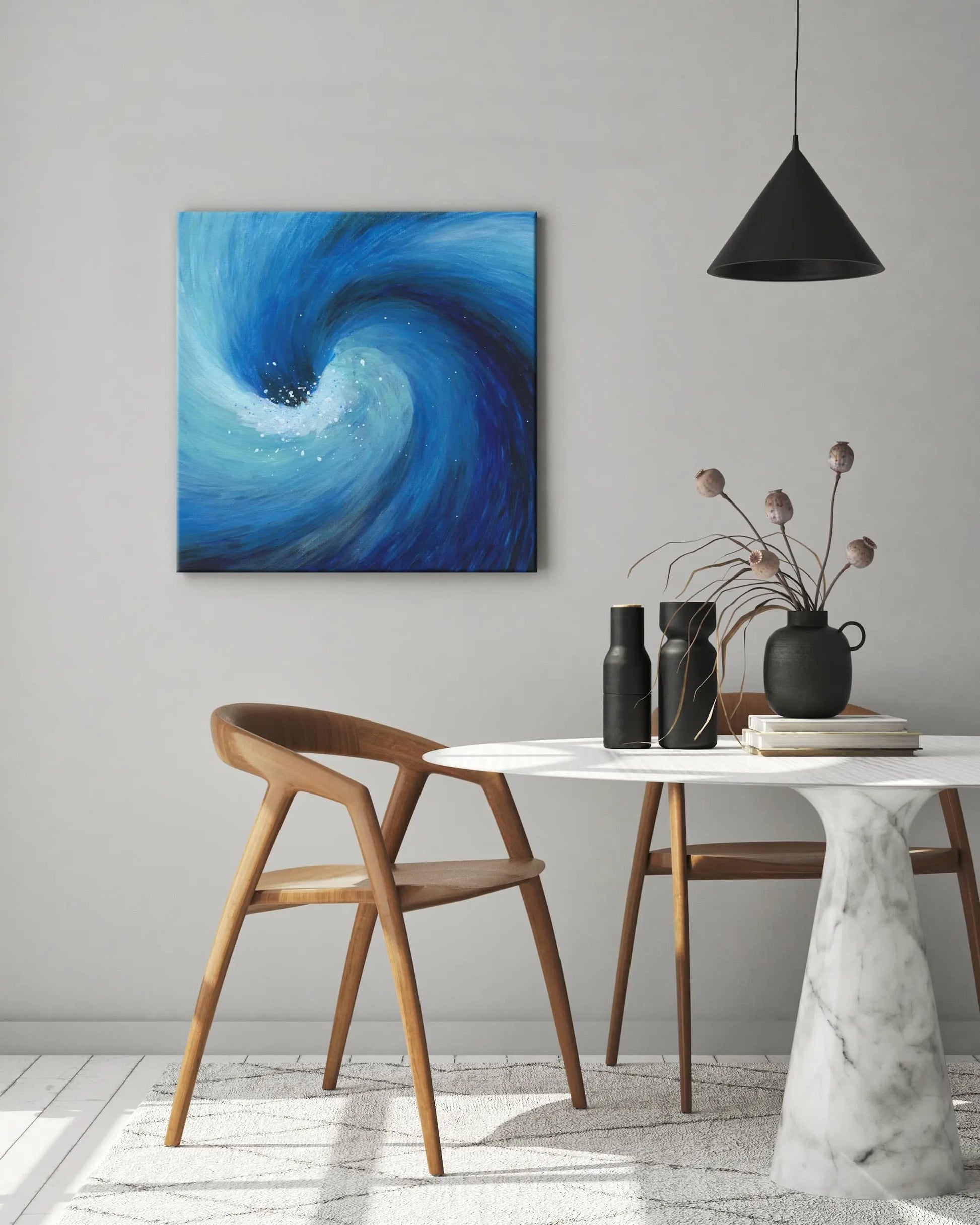 Modern interior with a marble table, wooden chairs, and a blue abstract painting on the wall.