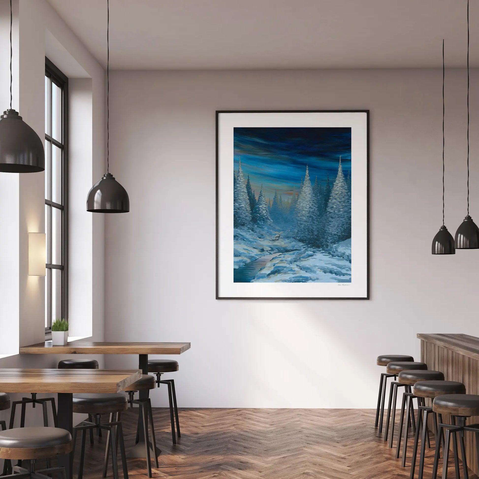 Modern interior with a framed artwork of a snowy landscape on a wall.