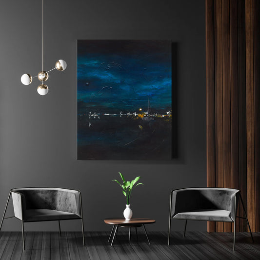 Modern living room with dark gray walls, two gray chairs, a small round table with a plant, and a large framed artwork of a night sky.