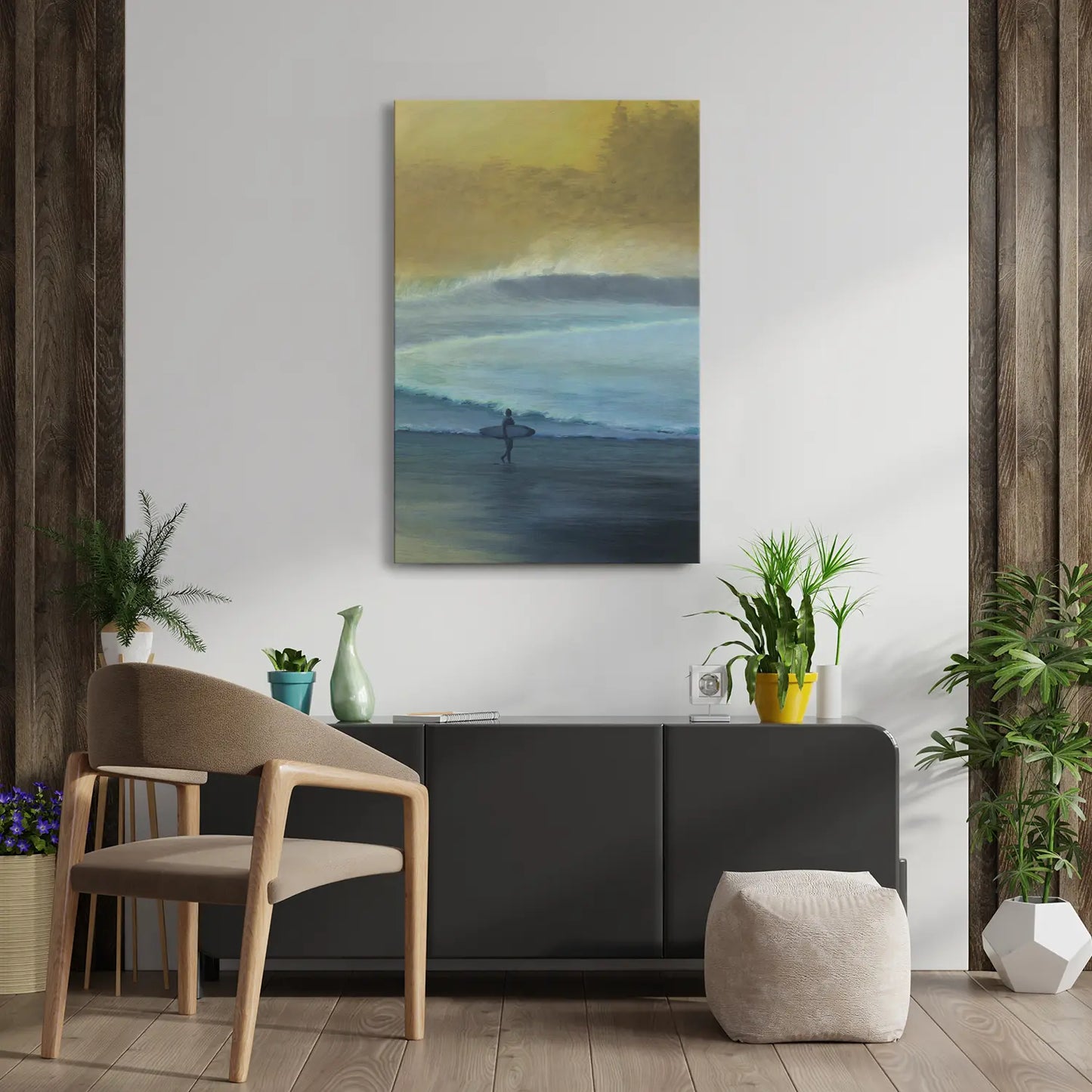 Modern interior with a painting of a person on a surfboard, chair, and plants.