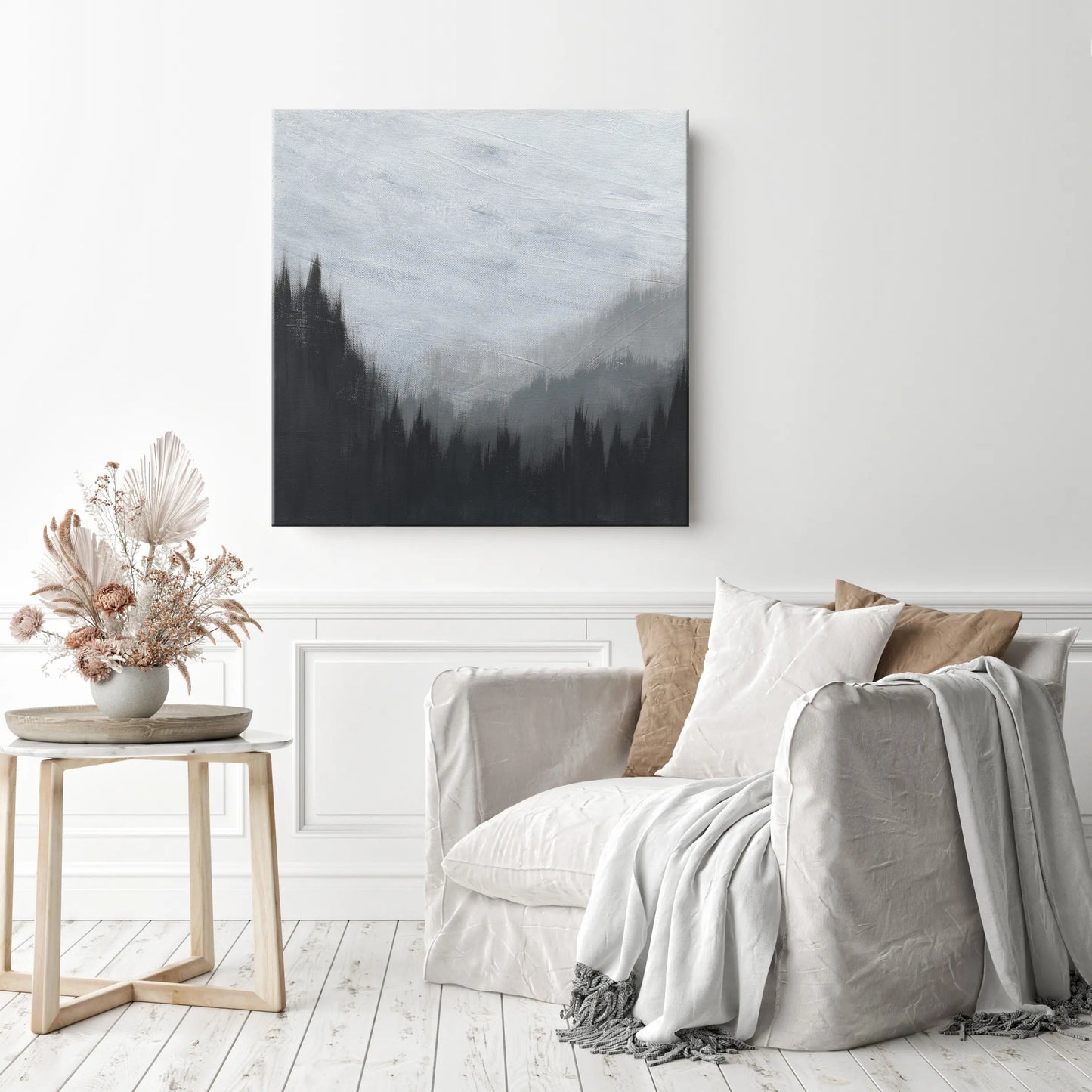 Living room with a sofa, side table, and wall art